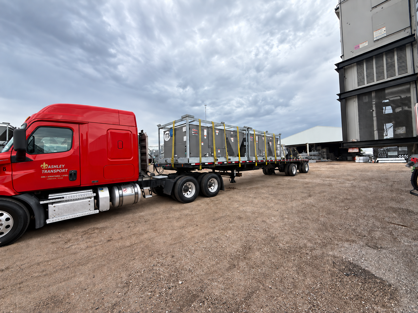Ashley Transport truck hauling large industrial equipment