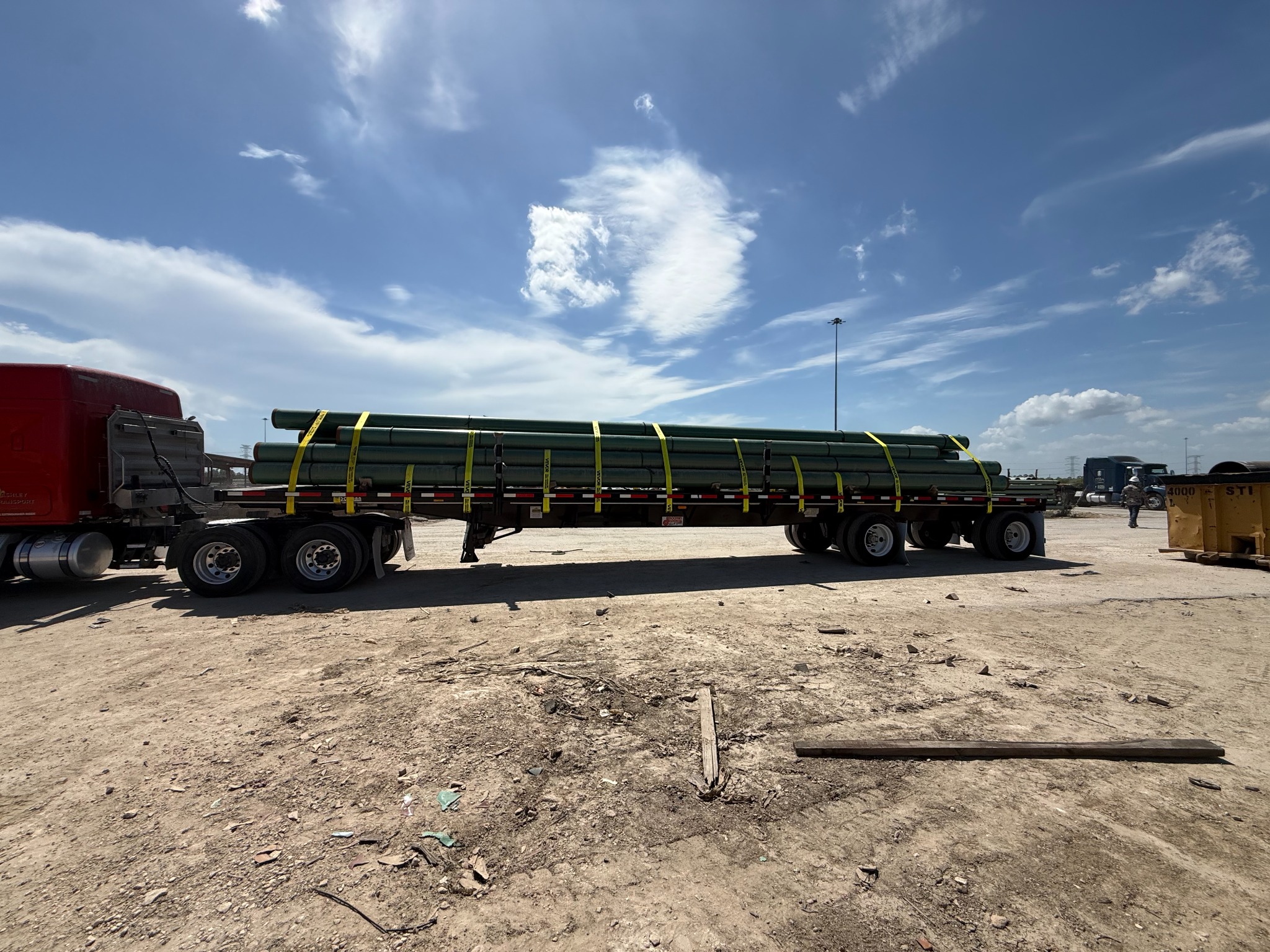 Ashley Transport flatbed carrying a load of pipe
